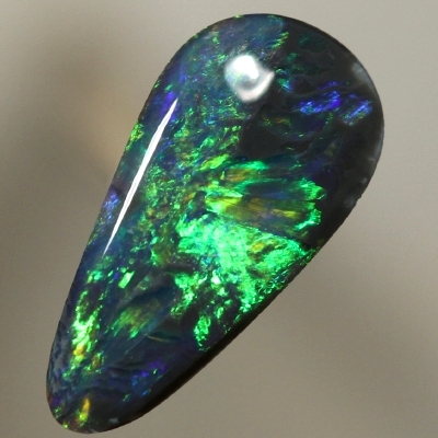 SOLID BLACK OPAL Bright orange plays along side green over blue